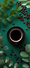 A rich, dark coffee cup sits amidst a vibrant arrangement of green leaves and coffee beans on a teal background, showcasing a serene and invigorating scene.