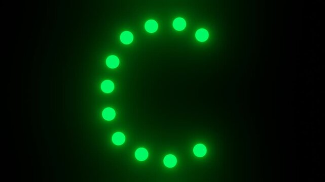 Flashing green dot matrix letter C on black background