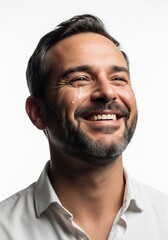Obraz premium Portrait of a smiling man with tears of joy on his face, expressing overwhelming happiness