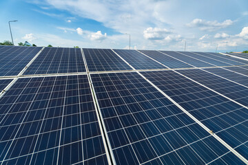 Photovoltaic solar power panel on dramatic sunset blue sky background, green clean Alternative power energy concept.