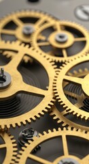 Detailed close-up view of intricate gold and gray gears in a mechanical mechanism.