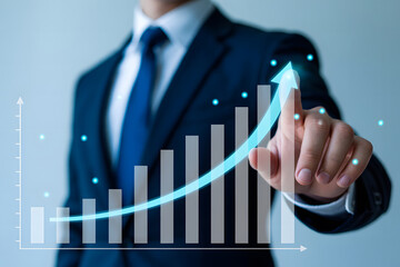Businessman in suit pointing at rising bar chart with arrow, symbolizing financial growth, success, progress, profit, investment, and business strategy