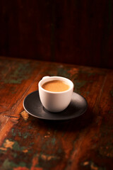 Cup of coffee on rustic wooden background. Soft focus. Copy space	