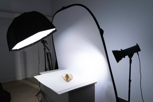 A professional food photography studio setup with an octabox and large diffuser