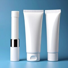 Three white plastic tubes and a lipstick-style tube on a light blue background