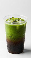 a transparent plastic cup filled with dirty matcha latte, layered vibrant green matcha and dark espresso, slightly uneven blending between layers