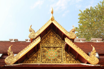 Carved gold roof of church in Wat Phra That Cho Hae