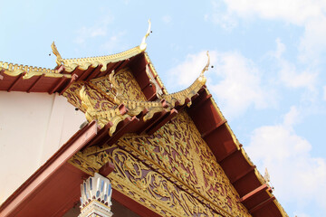 Carved gold roof of church in Wat Phra That Cho Hae