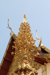 Carved gold roof of church in Wat Phra That Cho Hae