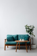 Minimalist living room with teal sofa and green plant