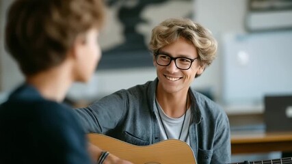 Engaging Music Teacher Demonstrating Guitar Techniques to Teens