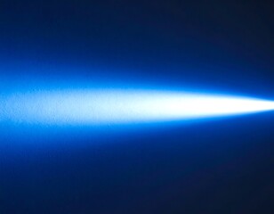 Bright blue light beam against dark background