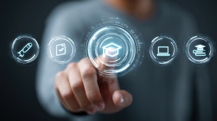 A person wearing a gray suit is interacting with a holographic interface. Their hand hovers over a central, glowing button displaying a graduation cap icon. Surrounding the button 