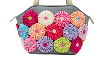 Colorful fabric flowers adorn a grey tote bag