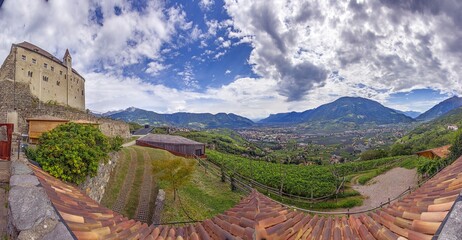Drone panorama over Etsch Valley with castle