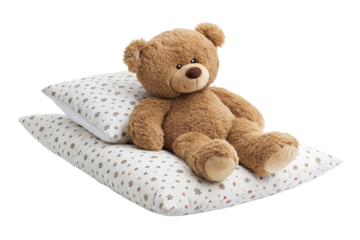 Cozy teddy bear resting on a soft pillow with printed design for kids room and nursery decor