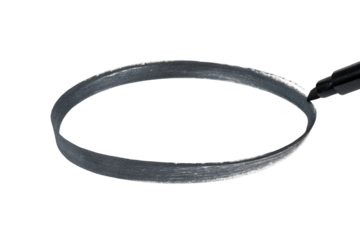 Artist draws perfect circle freehand with marker on black background close up macro photography