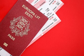 Estonia passport and airlines boarding pass tickets. Travel flights and avia tourism in Europe