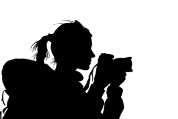 Creative individual capturing a moment with a professional camera, embodying passion for visual storytelling and artistic expression