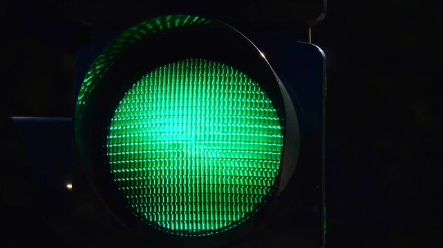 GO concept on the road, green light: the traffic light turns green