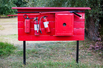 Outdoor fire safety station with extinguishers, tools and cabinet