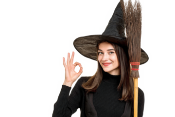 Young caucasian woman dressed as a witch holding a broom isolated cheerful and confident showing ok gesture.