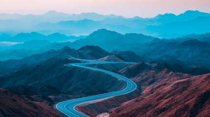 Fototapeta premium Captivating winding road gracefully traverses vast, layered mountain ranges, bathed in ethereal hues of deep blue, teal, and soft rose under serene, gradient sky