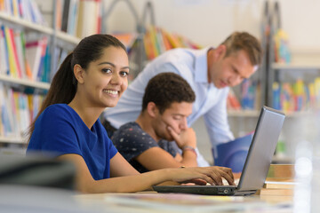 happy young female student study in the school library