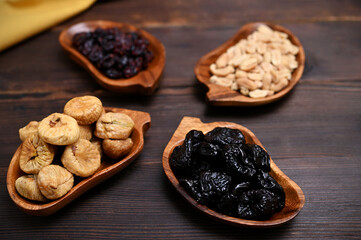 still life with dried fruits, figs, prunes, cranberries and nuts