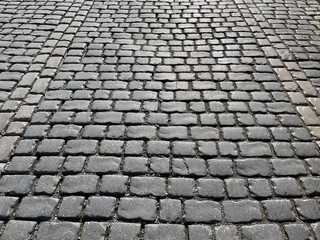 Abstract background. Old cobblestone pavement closeup