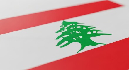 A closeup view of the lebanese flag with its distinctive cedar tree emblem
