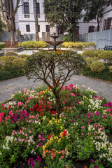 Tranquil view of the Garden of dreams in Kathmandu, Nepal. Beautiful landscaped garden with stone pathways, water fountains, blooming trees and elegant classical architecture offering a serene escape.