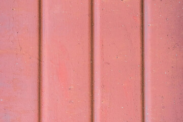 Old metal surface light red paint vertical lines fence pattern texture background
