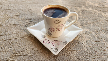 A porcelain cup of Turkish coffee is perfect for relaxation and conversation.