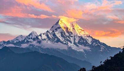 Mountain peak bathed in golden sunrise light