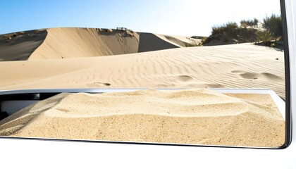 Sand dunes seen through a vehicle window