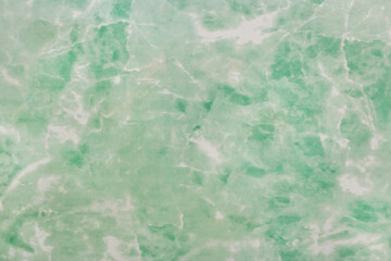 Siding, facing material, pressed cardboard, texture of the ceiling in the bathroom, green and white abstract pattern, background