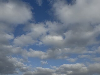 Cloudy Sky Backgrounds – Blue Sky with White and Grey Clouds. Collection of cloudy sky backgrounds featuring dynamic white and grey clouds against a blue sky