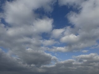 Cloudy Sky Backgrounds – Blue Sky with White and Grey Clouds. Collection of cloudy sky backgrounds featuring dynamic white and grey clouds against a blue sky
