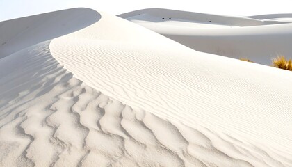 White sand dunes curve and ripple