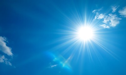 Fototapeta premium Bright Sun Shining in a Clear Blue Sky with Wispy Clouds