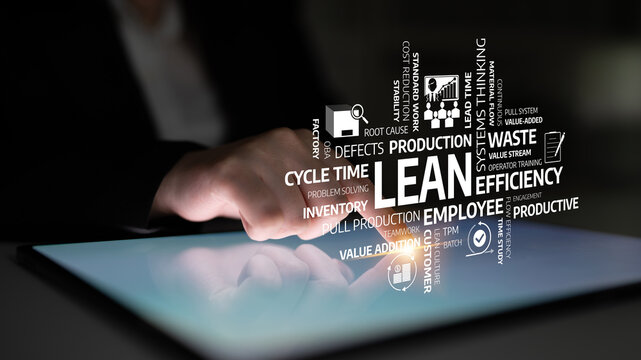 A business professional interacts with a tablet showcasing lean methodology principles such as efficiency, waste reduction, and continuous improvement for effective production. Tessel