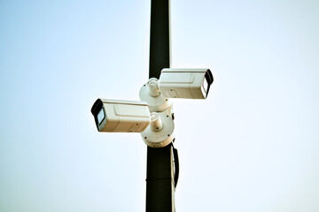 CCTV Cameras is installed on pillar to monitor traffic conditions on a city street. Two surveillance cameras.