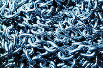 Shiny metal chains closeup. Heavy linked steel. Industrial strong security material. Iron chain...