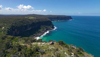 Coastal cliffs meet turquoise water