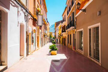 Fototapeta premium Historic buildings on a typical street in the old part of the coastal Denia town. Location place province of Alicante, Costa Blanca, Valencian Community, Spain, Europe.