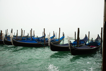 Obraz premium Gondolas, the typical and romantic form of transportation in Venice, one of the most typical and beautiful European cities