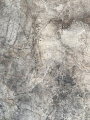 Marble stone texture with natural veins and cracks. High resolution marble stone surface with natural grey veins and cracks. Abstract mineral background for design, architecture and interior decor