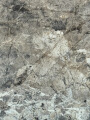 Marble stone texture with natural veins and cracks. High resolution marble stone surface with natural grey and white veins. Abstract mineral background perfect for architecture, design, interior