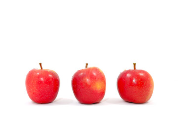 Fresh red apples together on white background close up view